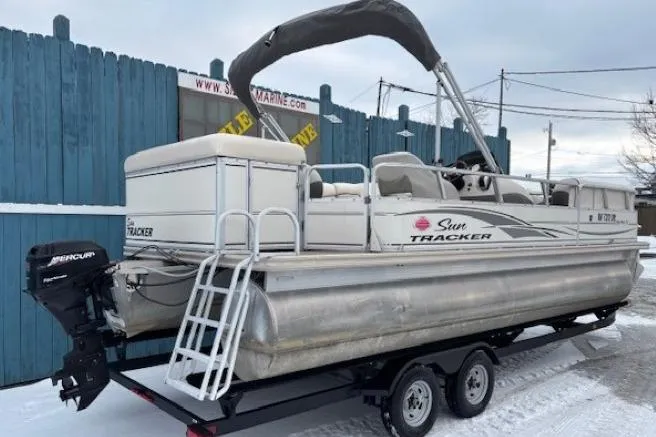 Slide: The Image of 2004 Sun Tracker Party Barge 22 Regency Edition pontoon boat on trailer in snowy setting. - 3
