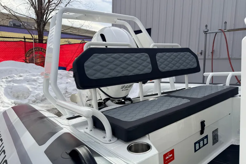 Slide: The Image of 2025 Highfield Sport 560 boat with cushioned seating and modern design. - 13