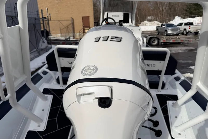 Slide: The Image of Highfield Sport 560 boat, 2025 model, featuring a 115 horsepower engine, docked outdoors. - 7