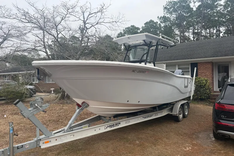 The Image of 2021 Sea Fox 268 Commander boat on trailer in residential driveway. - 1