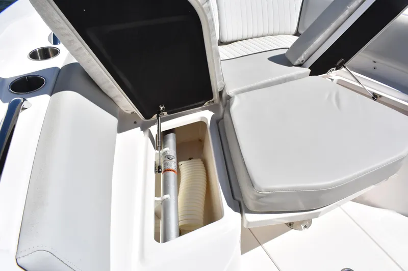 Slide: The Image of 2021 Sea Fox 268 Commander boat seat storage compartment open, revealing interior space. - 13