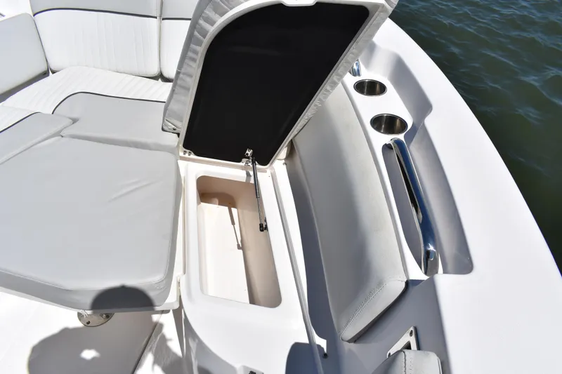 Slide: The Image of 2021 Sea Fox 268 Commander boat seating with open storage compartment and cup holders. - 14