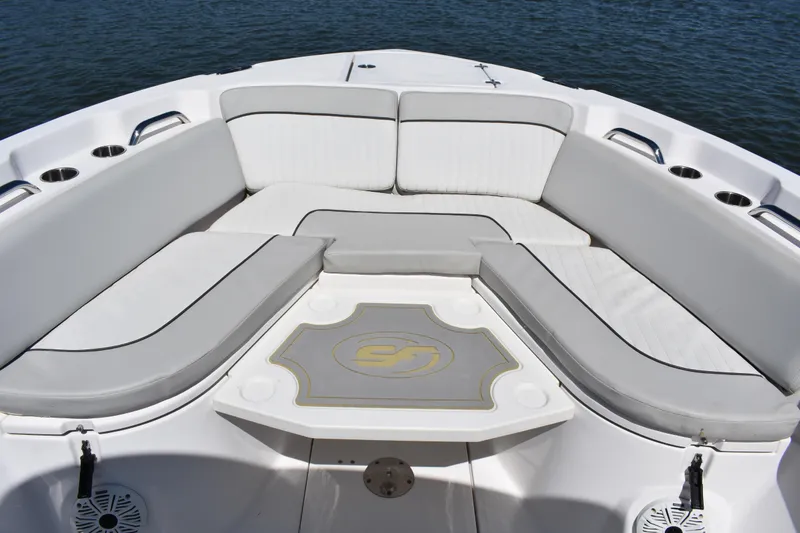 Slide: The Image of 2021 Sea Fox 268 Commander boat interior with cushioned seating and cup holders. - 15