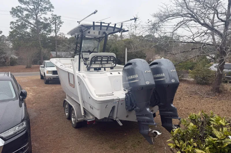 Slide: The Image of 2021 Sea Fox 268 Commander boat with dual Yamaha 150 engines on a trailer. - 2