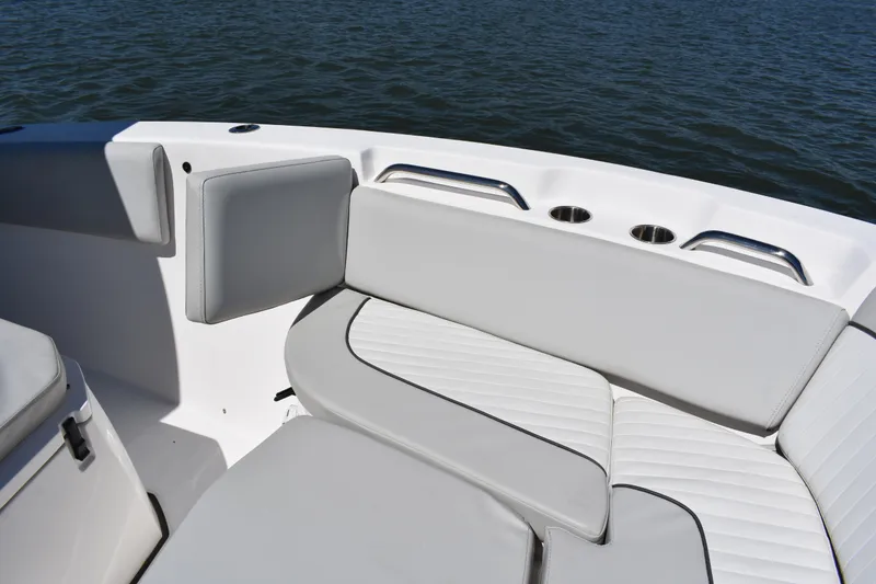 Slide: The Image of 2021 Sea Fox 268 Commander boat interior with cushioned seating and cup holders. - 21