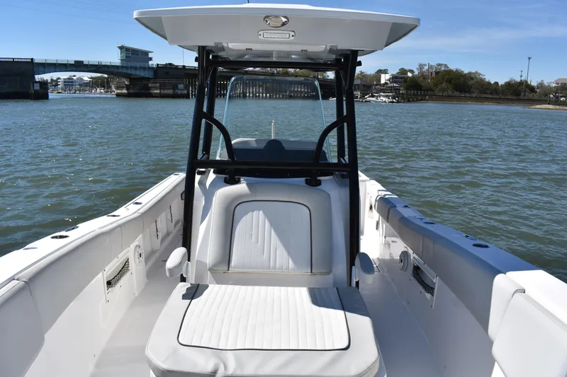 Slide: The Image of 2021 Sea Fox 268 Commander boat on water, featuring spacious seating and sleek design. - 23