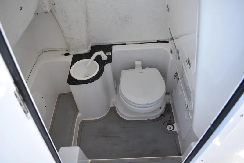 Slide: The Image of 2021 Sea Fox 268 Commander boat bathroom with toilet and sink. - 29