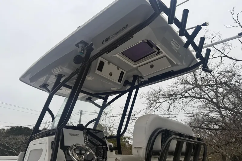 Slide: The Image of 2021 Sea Fox 268 Commander boat with T-top and rod holders, viewed from below. - 3