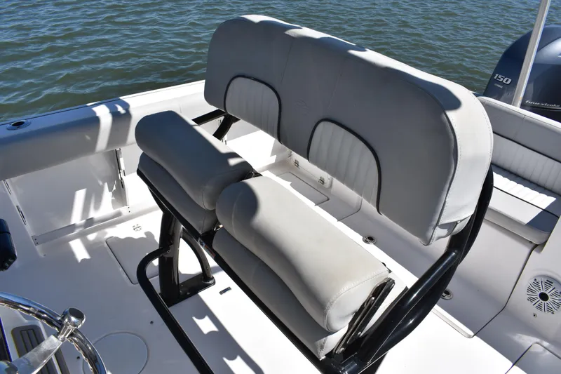 Slide: The Image of 2021 Sea Fox 268 Commander boat seating with water backdrop. - 32