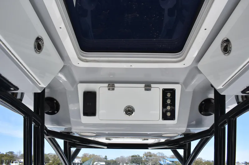 Slide: The Image of 2021 Sea Fox 268 Commander boat interior ceiling with control panel and storage. - 35