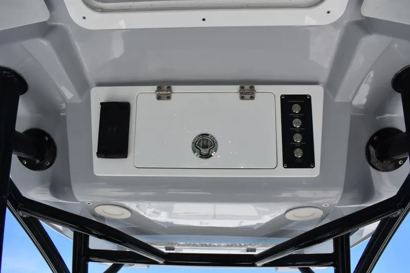 Slide: The Image of 2021 Sea Fox 268 Commander boat console with control panel and storage compartment. - 38