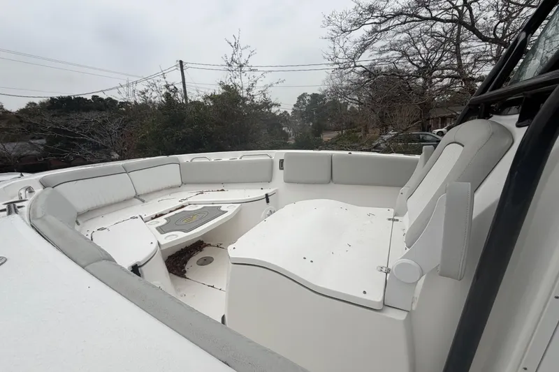 Slide: The Image of 2021 Sea Fox 268 Commander boat interior with white seating and table. - 4