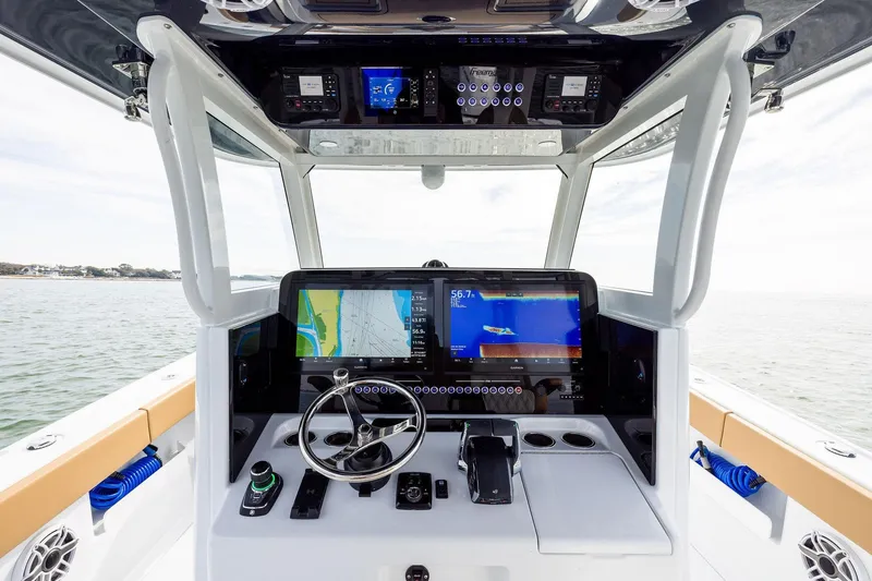 Slide: The Image of 2026 Freeman 32 boat dashboard with advanced navigation and control systems. - 11