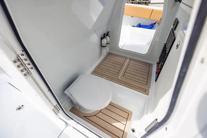Slide: The Image of 2026 Freeman 32 boat interior with modern toilet and wooden flooring. - 9