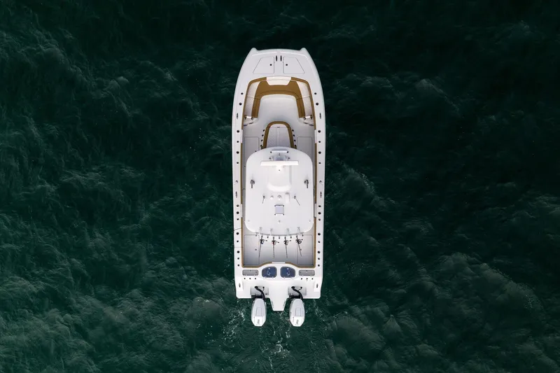 Slide: The Image of Aerial view of 2026 Freeman 32 boat on dark ocean waters. - 13