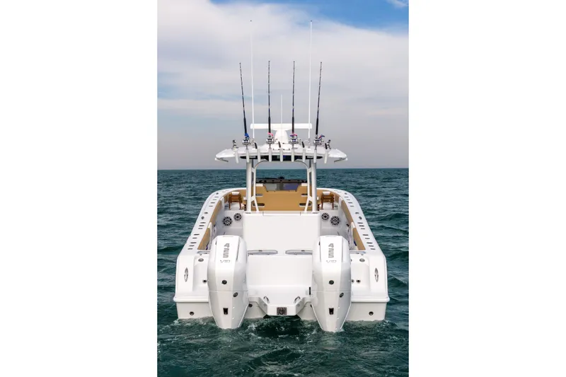 Slide: The Image of 2026 Freeman 32 boat on open water, featuring dual outboard engines. - 6