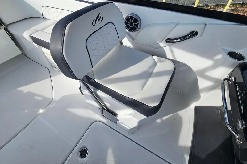 Slide: The Image of 2017 Monterey M-45 boat interior with cushioned seating and sleek design. - 11