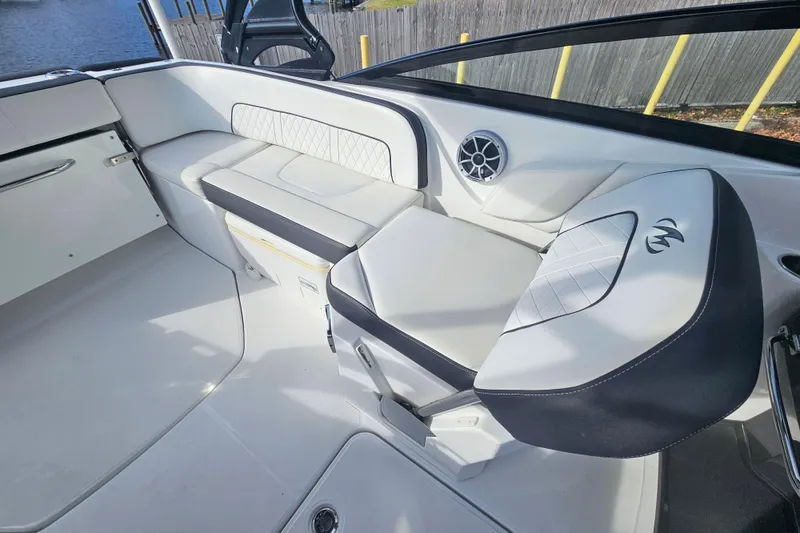 Slide: The Image of 2017 Monterey M-45 boat interior with white seating and speaker detail. - 12