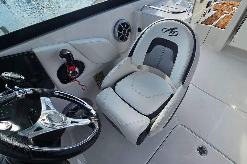 Slide: The Image of Captain's seat and steering wheel of 2017 Monterey M-45 boat interior. - 13