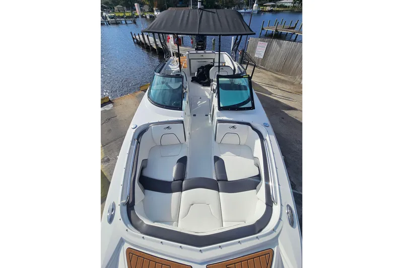 Slide: The Image of 2017 Monterey M-45 boat with spacious seating, docked by a serene waterfront. - 20