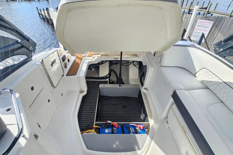 Slide: The Image of 2017 Monterey M-45 boat interior with open engine compartment, dockside view. - 22