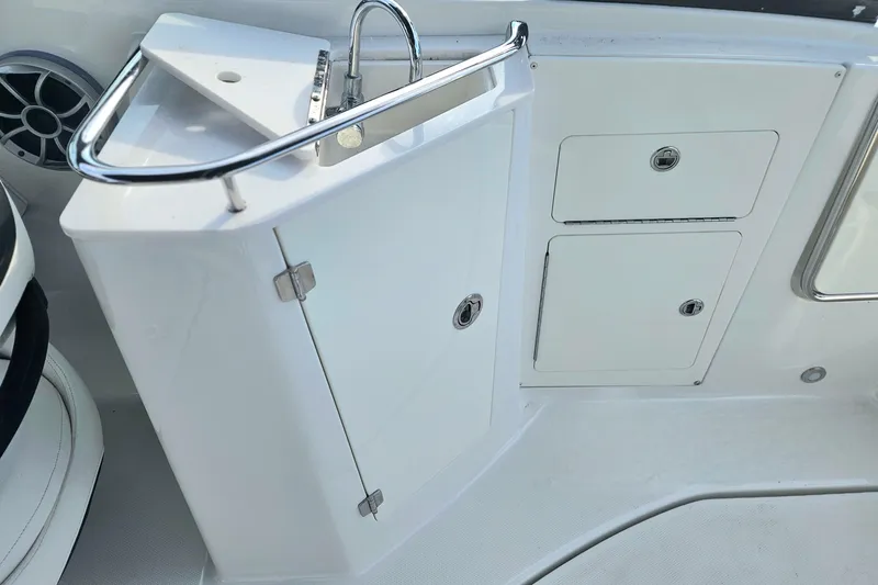 Slide: The Image of 2017 Monterey M-45 boat interior with sink and storage compartments. - 9