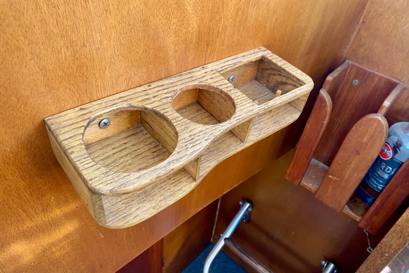 Slide: The Image of Wooden cup holder on 1979 Outer Reef 26/31 boat interior wall. - 101