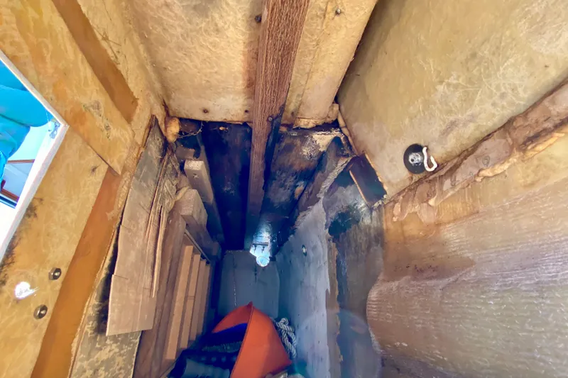 Slide: The Image of Interior view of a 1979 Outer Reef 26/31 boat hull, showing structural details. - 109