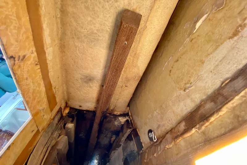 Slide: The Image of Interior view of a 1979 Outer Reef 26/31 boat, showcasing structural details. - 111