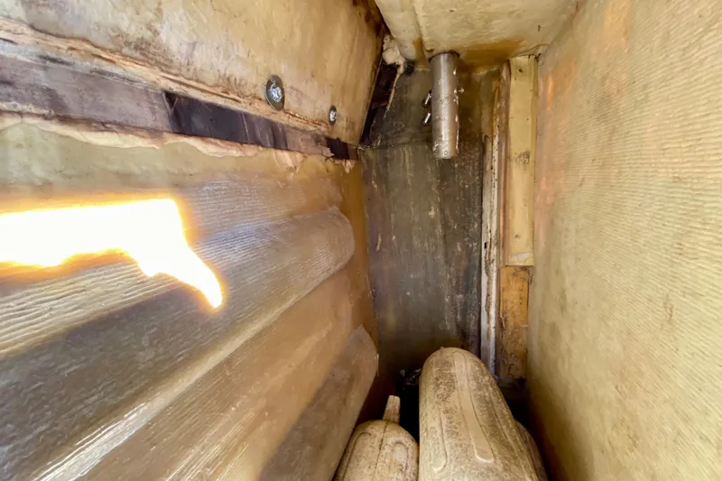 Slide: The Image of Interior view of a 1979 Outer Reef 26/31 boat hull with visible structural details. - 112