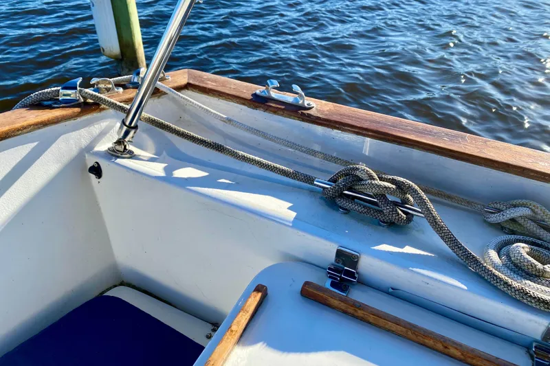 Slide: The Image of Cockpit of 1979 Outer Reef 26/31 sailboat with ropes and wooden trim. - 15