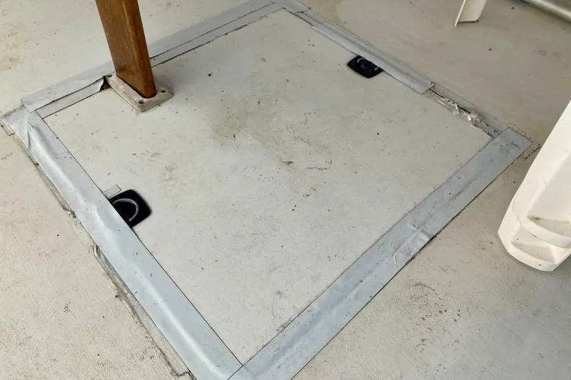 Slide: The Image of Hatch cover on 1979 Outer Reef 26/31 boat deck with wooden support. - 23