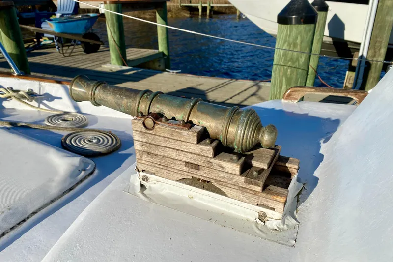 Slide: The Image of Vintage cannon on 1979 Outer Reef 26/31 boat deck, dockside view. - 42