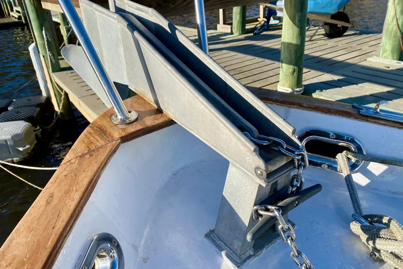 Slide: The Image of Close-up of a 1979 Outer Reef 26/31 boat's anchor chain and deck details. - 44