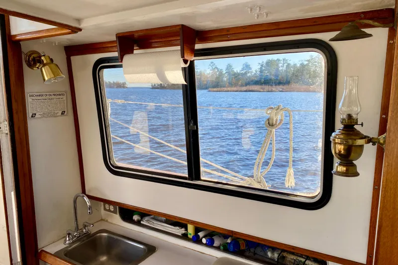 Slide: The Image of Interior view of 1979 Outer Reef 26/31 boat with window overlooking water. - 61