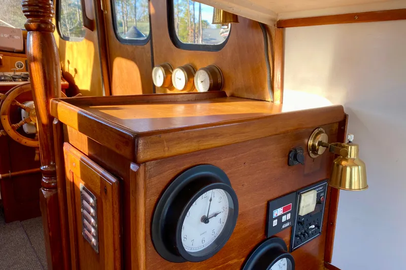 Slide: The Image of Interior of a 1979 Outer Reef 26/31 boat with wooden dashboard and nautical instruments. - 66