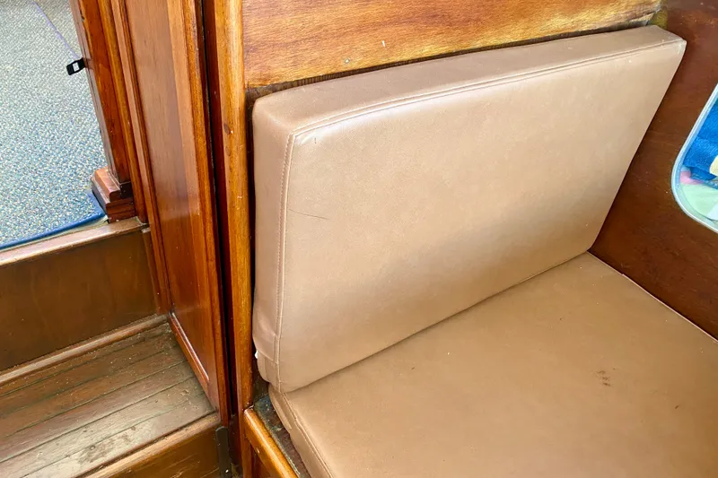 Slide: The Image of Brown leather seating on 1979 Outer Reef 26/31 boat with wooden interior. - 67