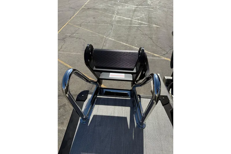 Slide: The Image of 2026 Avalon 2785 QL boat seat with chrome handles on a textured deck. - 10