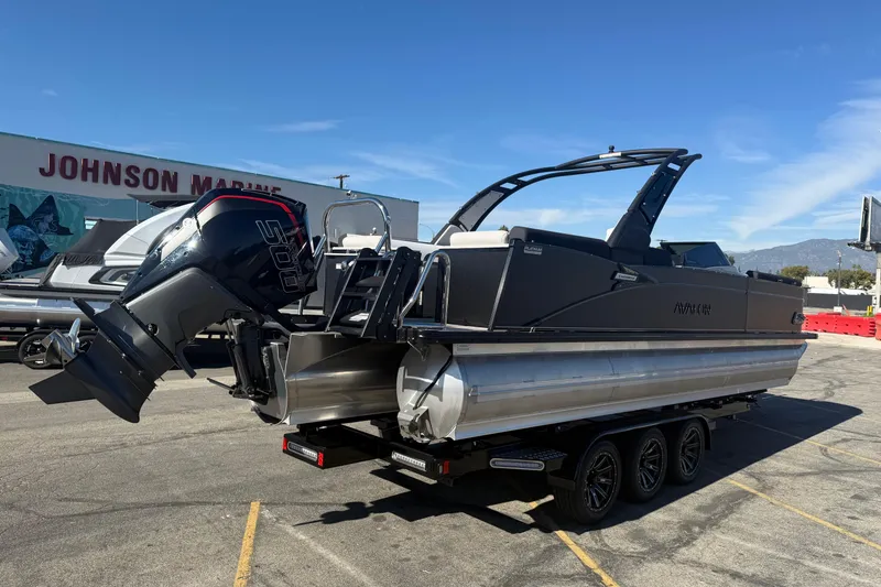 Slide: The Image of 2026 Avalon 2785 QL pontoon boat with powerful outboard motor at Johnson Marine. - 2