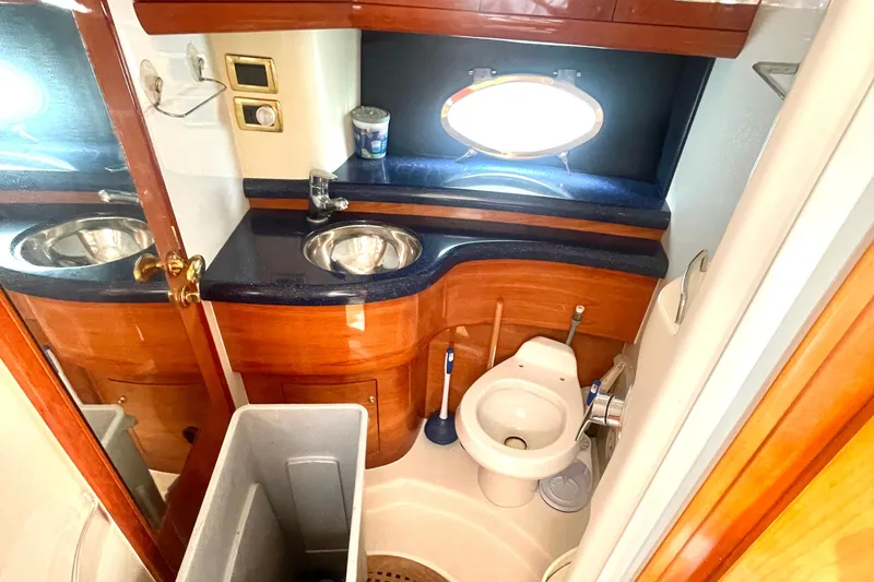 Slide: The Image of Luxurious bathroom in 2006 Cranchi Mediterranee 50 HT yacht with wooden cabinetry and modern fixtures. - 6