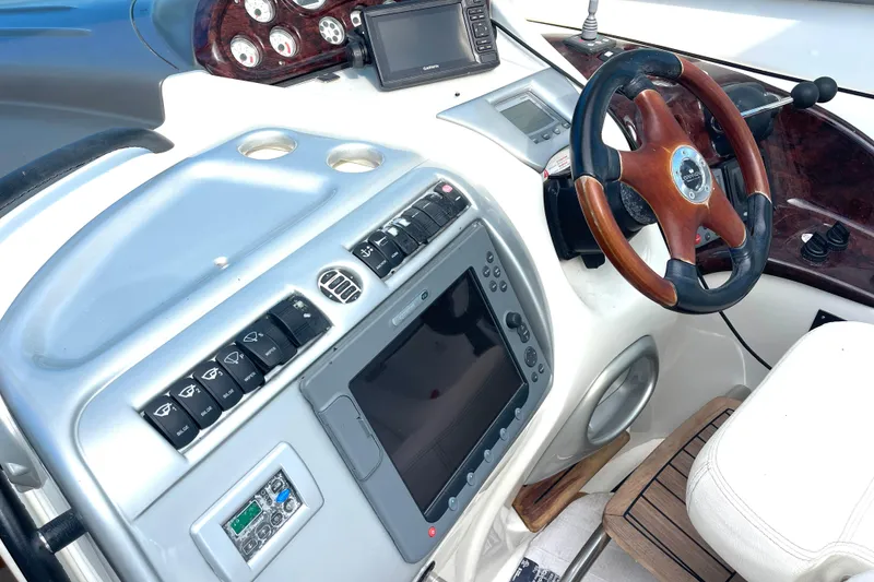 Slide: The Image of Control panel of 2006 Cranchi Mediterranee 50 HT yacht with steering wheel and navigation instruments. - 9