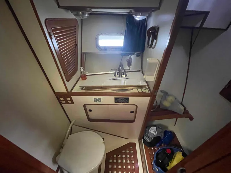 Slide: The Image of Interior view of 1986 Kha Shing Spindrift yacht in marina. - 15