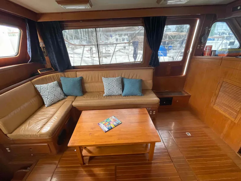 Slide: The Image of Interior of a 1986 Kha Shing Spindrift yacht with wooden furnishings. - 18
