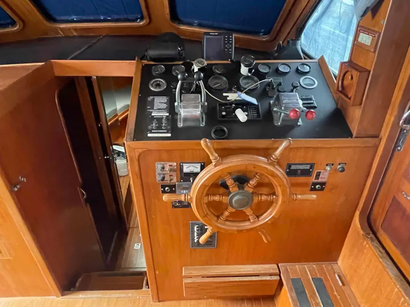 Slide: The Image of Interior of a 1986 Kha Shing Spindrift yacht with wooden furnishings. - 20