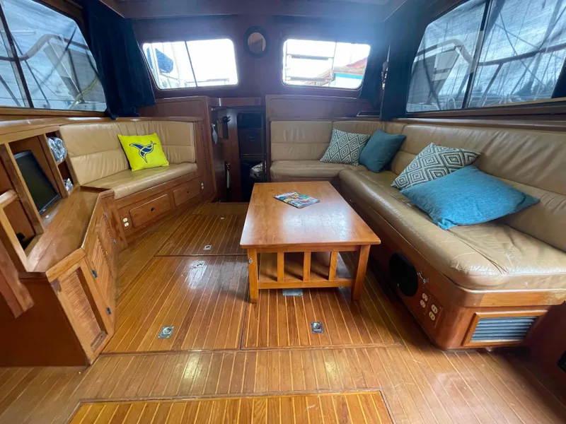Slide: The Image of Interior of a 1986 Kha Shing Spindrift yacht with wooden paneling. - 29