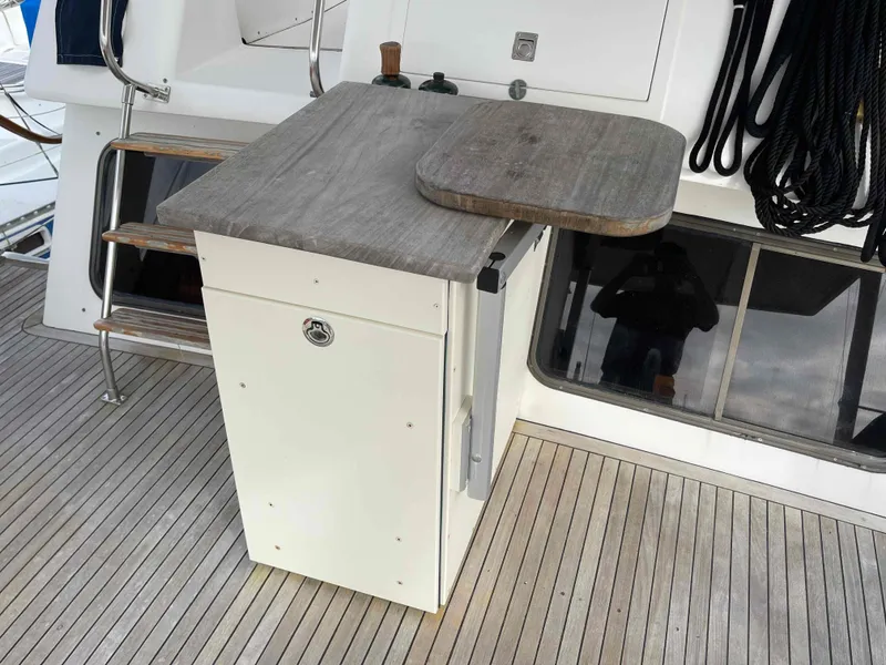 Slide: The Image of 1986 Kha Shing Spindrift deck with ropes and storage area. - 36