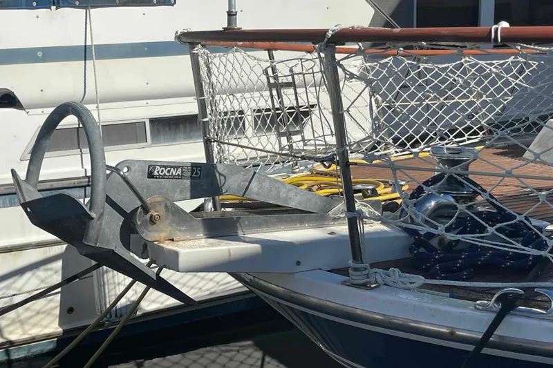 Slide: The Image of 1986 Kha Shing Spindrift yacht kitchen with wooden cabinets, dual sink, and appliances. - 4