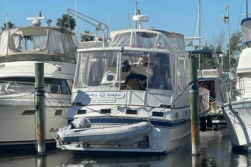 Slide: The Image of 1986 Kha Shing Spindrift yacht interior with wooden decor and blue seating. - 5