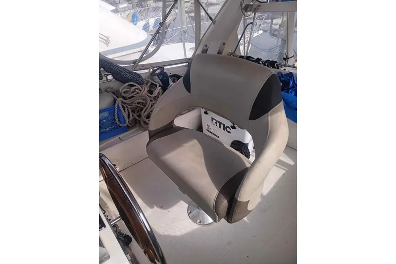 Slide: The Image of Interior cabin of 1986 Kha Shing Spindrift yacht with wooden finish and gray cushions. - 7