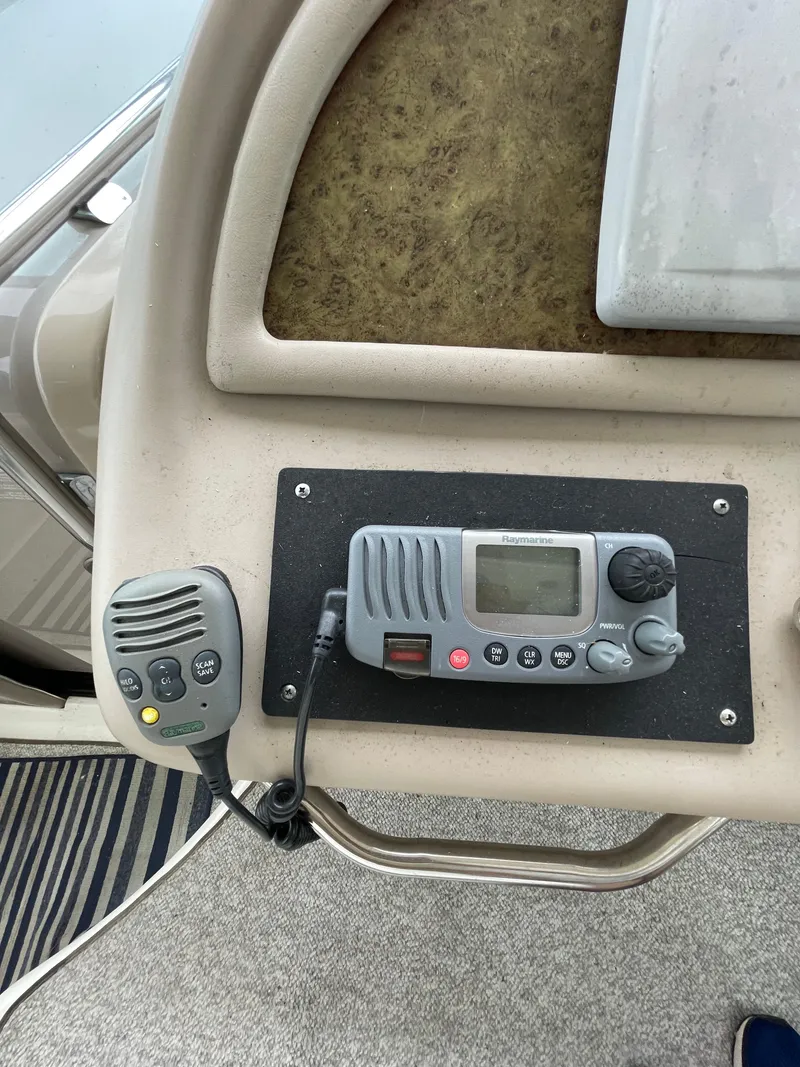 Slide: The Image of Control panel of a 2001 Sea Ray 310 Sundancer boat with radio equipment. - 14